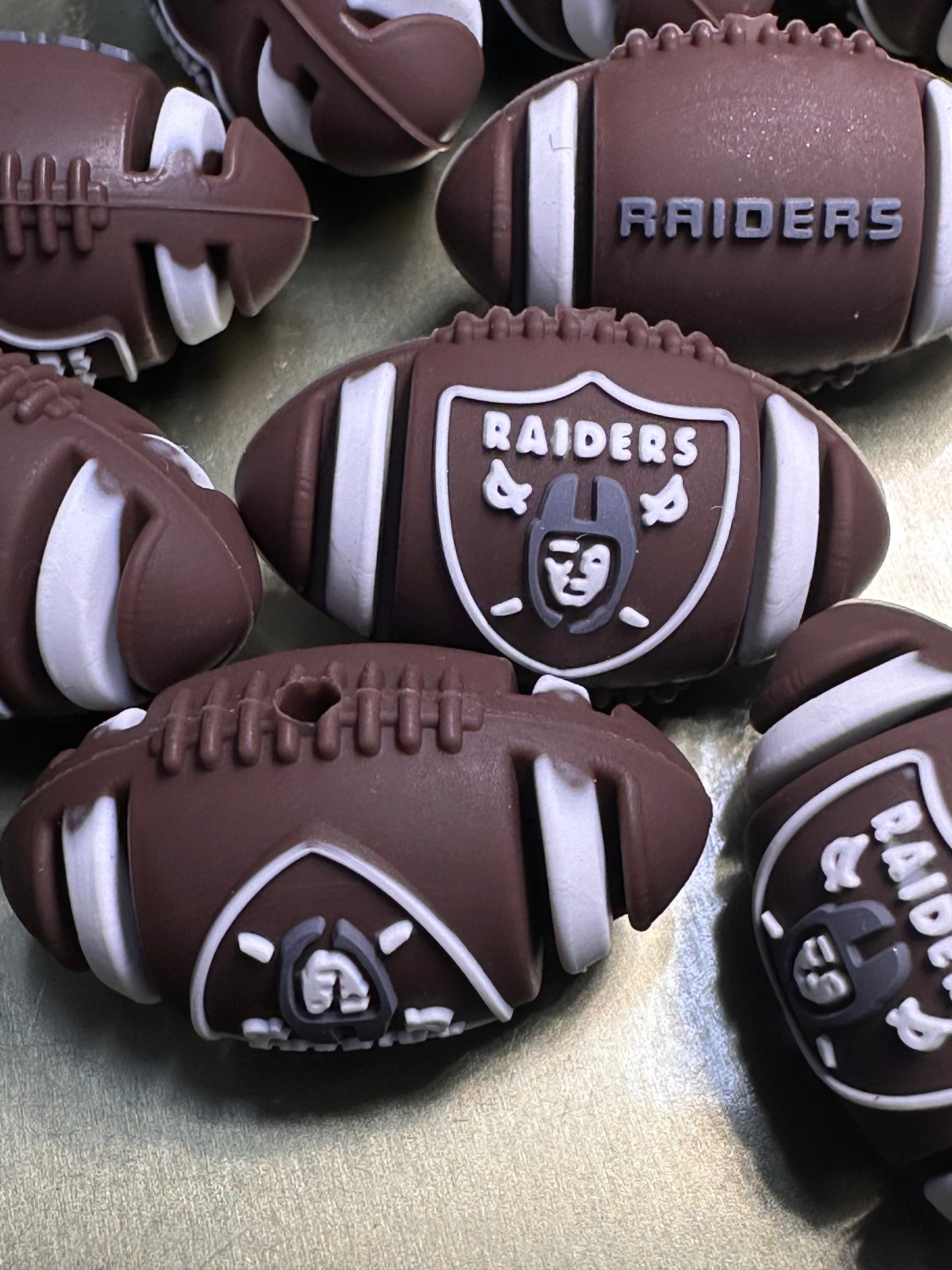 3D Las Vegas Raiders focal bead / football shaped silicone bead