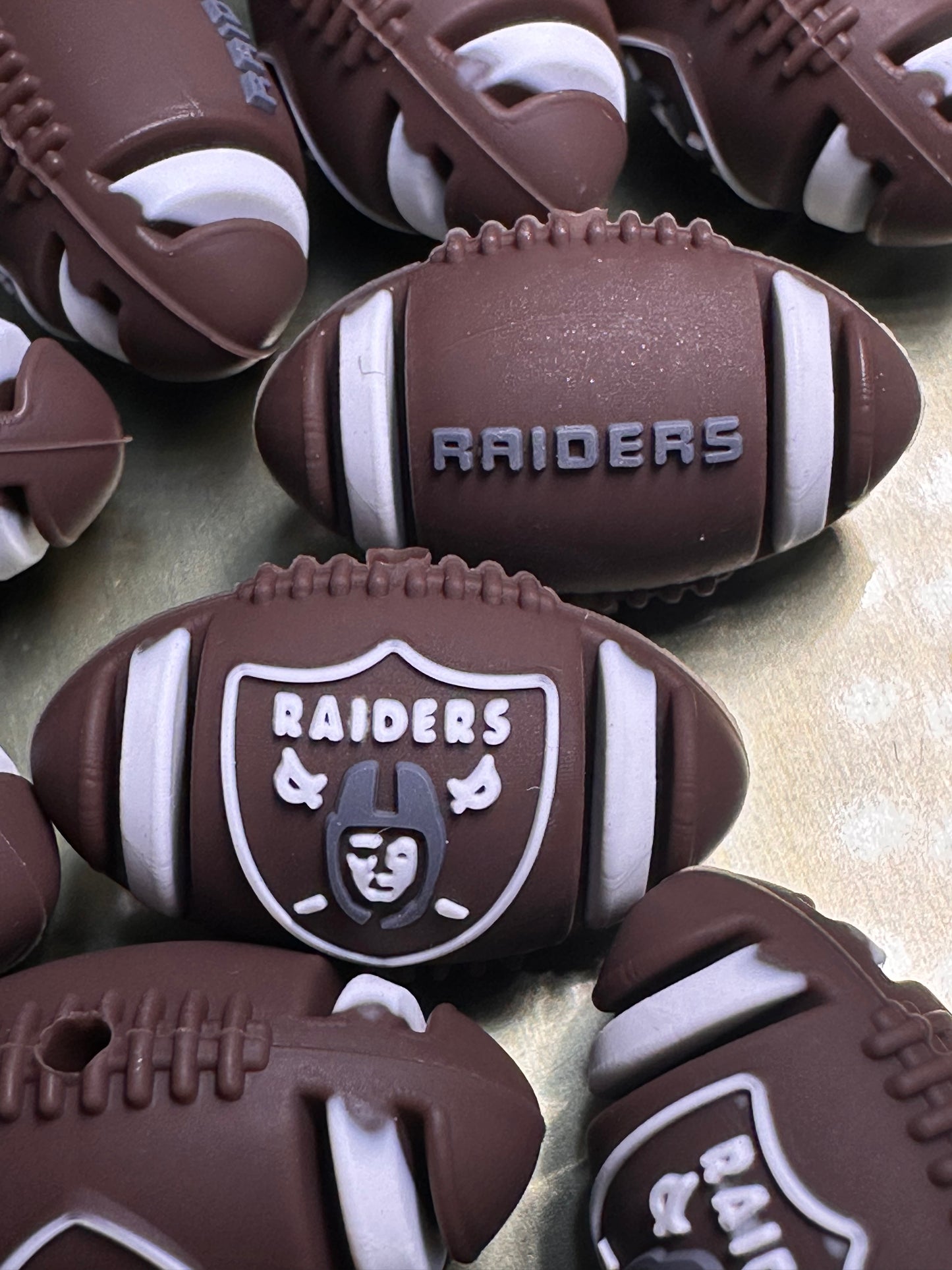 3D Las Vegas Raiders focal bead / football shaped silicone bead