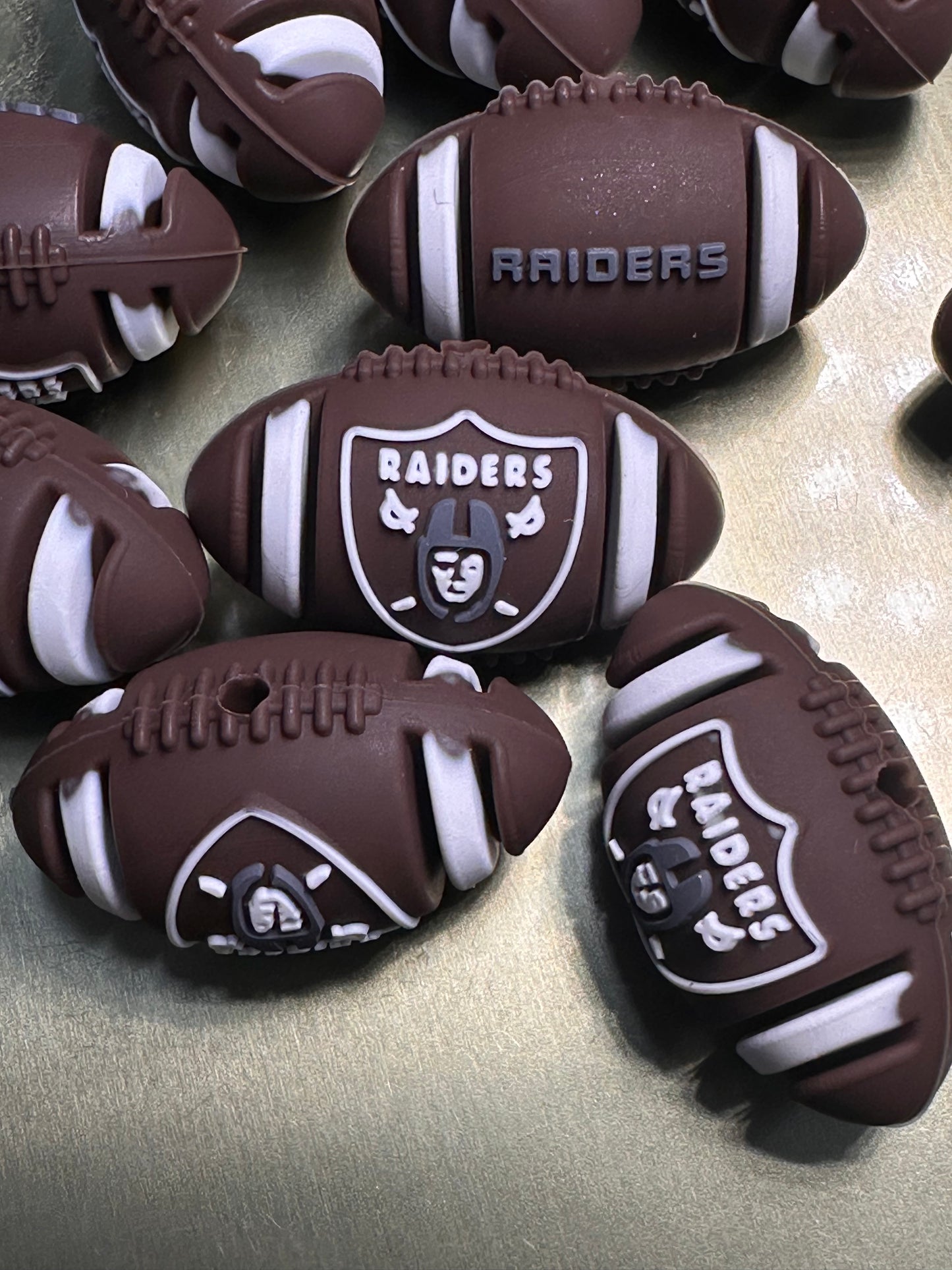 3D Las Vegas Raiders focal bead / football shaped silicone bead