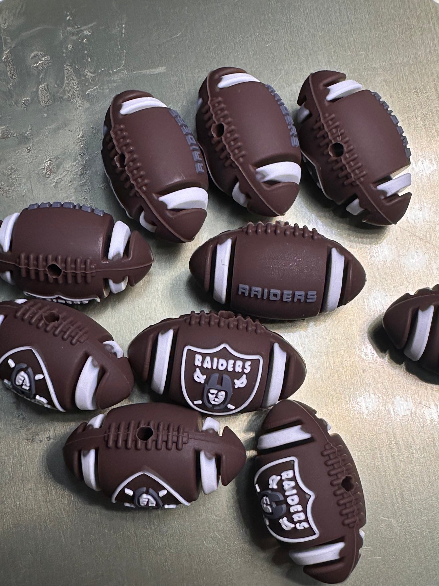 3D Las Vegas Raiders focal bead / football shaped silicone bead