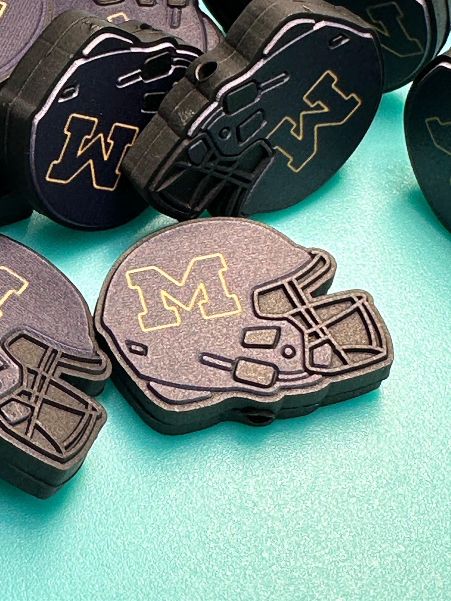 Michigan focal bead/ football/ helmet shaped/ pen beading/