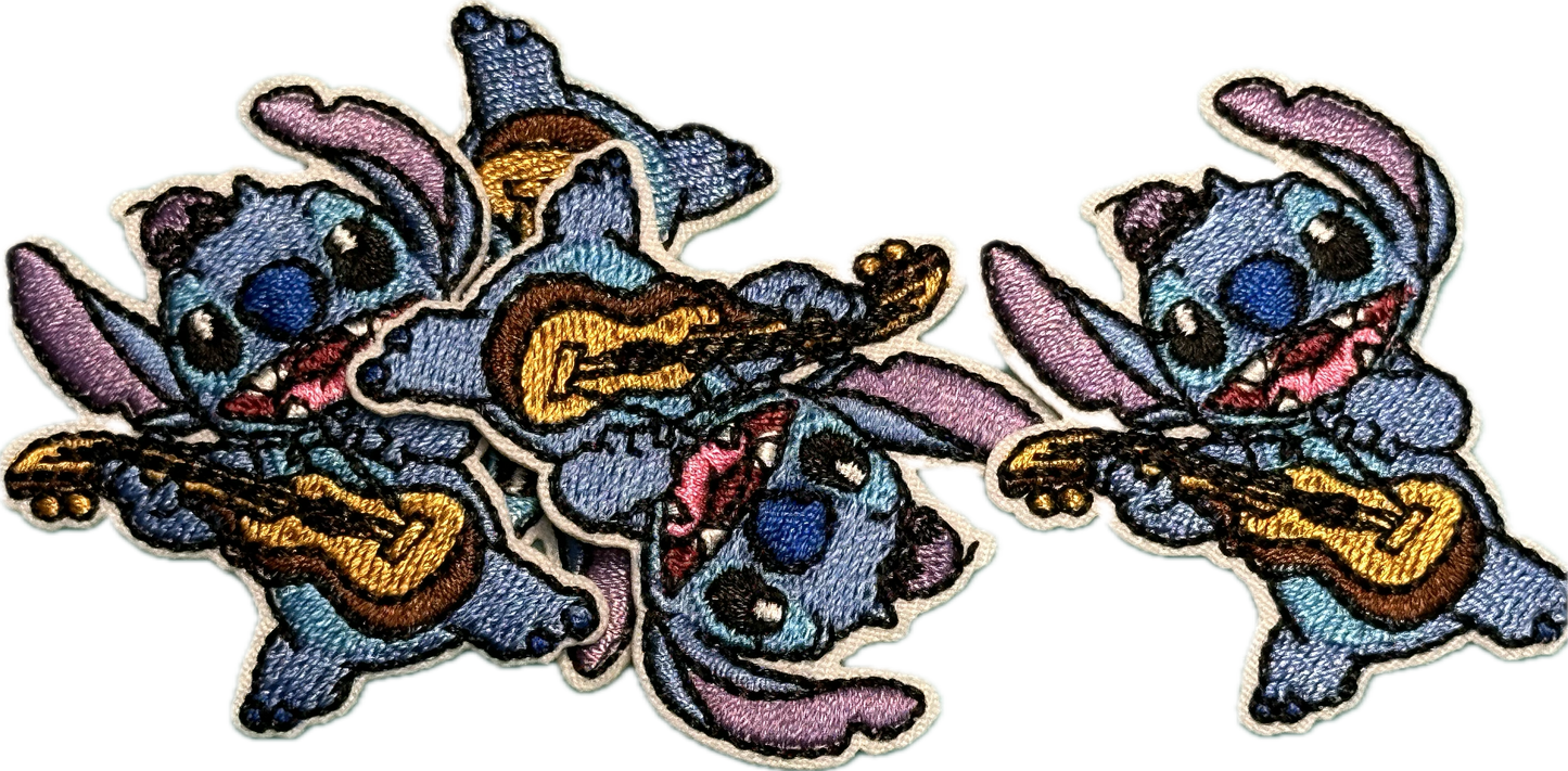 EVERYONES FAVORITE BLUE GUY PLAYING GUITAR IRON ON SMALL PATCH/ APPROX.  2" x 2"